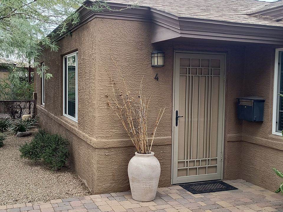 Custom steel security door with sun screen. Locking mailbox. Dusk to dawn lighting at entry doors.