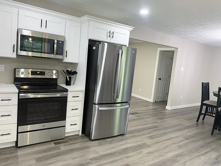 New Stainless steel appliances. Ice maker and water dispenser located in fridge. micro. Dishware, cups, utensils, pots pans