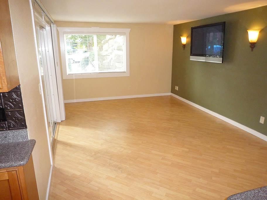 Angled Maple Flooring, 50-inch Flatscreen TV, Slider off Liv