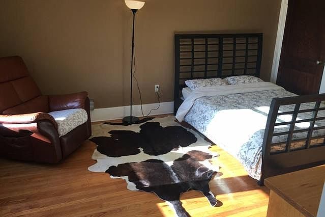 Bedroom with authentic cowskin rug