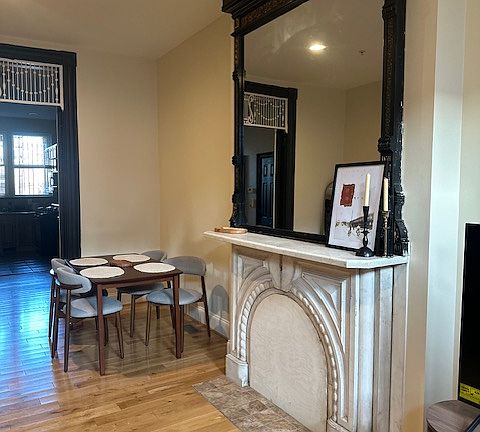 Marble fireplace & dining area.