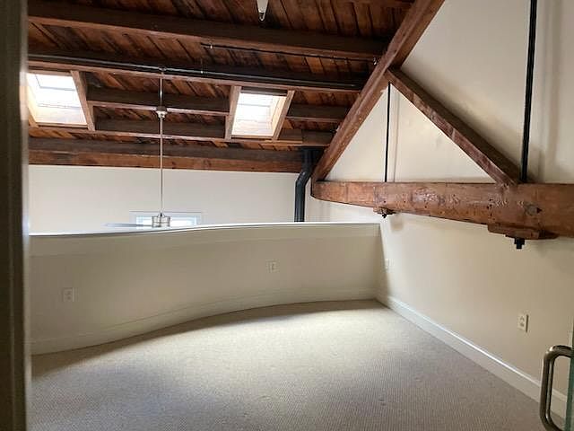 Loft bedroom or office with dedicated closet