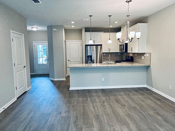 Front door and kitchen