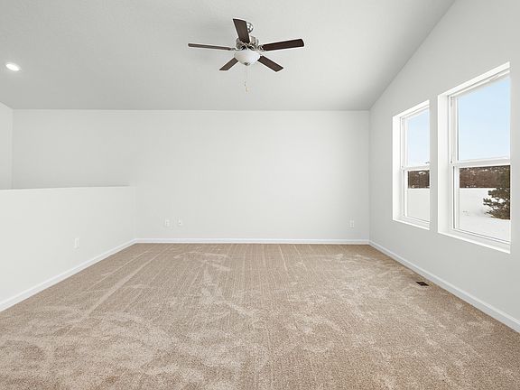 The family room is spacious with large windows