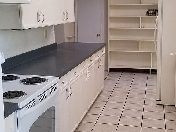 Kitchen has lots of counter space and plenty of storage