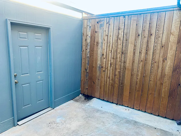 Private patio + entrance to garage