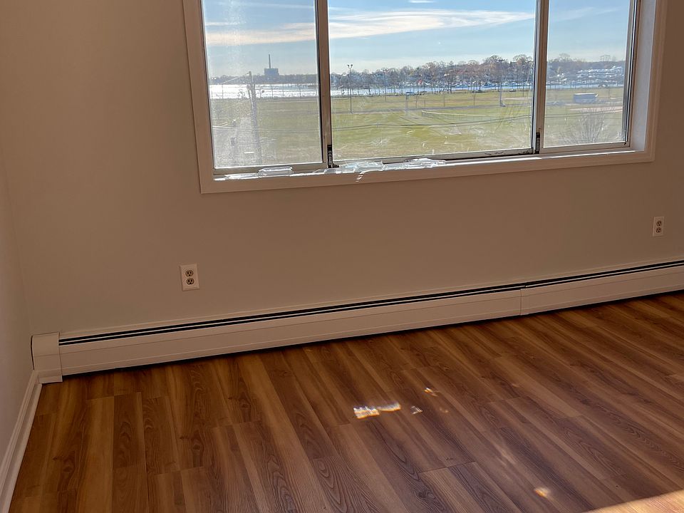 Living room with wonderful view of the park and water.