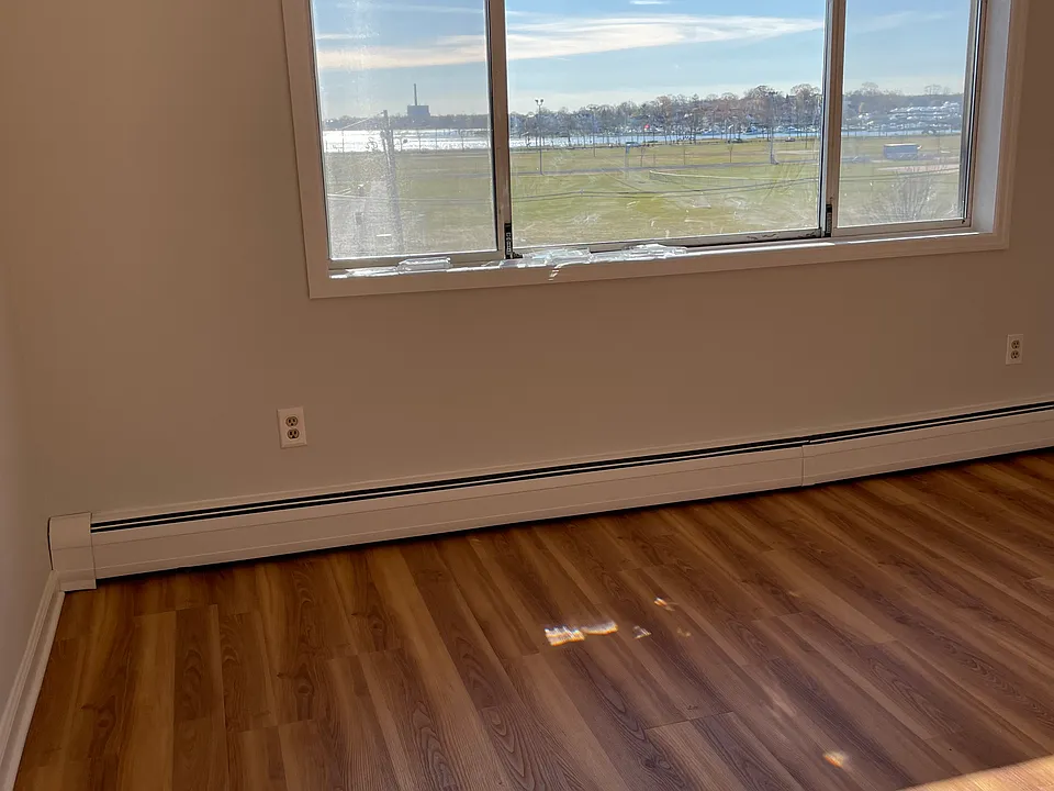 Living room with wonderful view of the park and water.