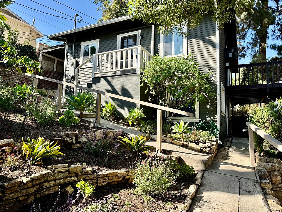 Stairs to front door and walkway to patio.