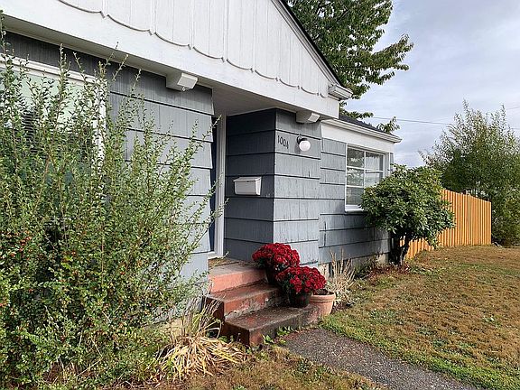 Partial front of house, with new fencing for privacy.