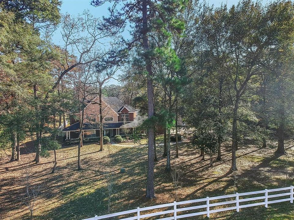 Gorgeous home on wooded 5 acre home site in Red Oak Ranch.