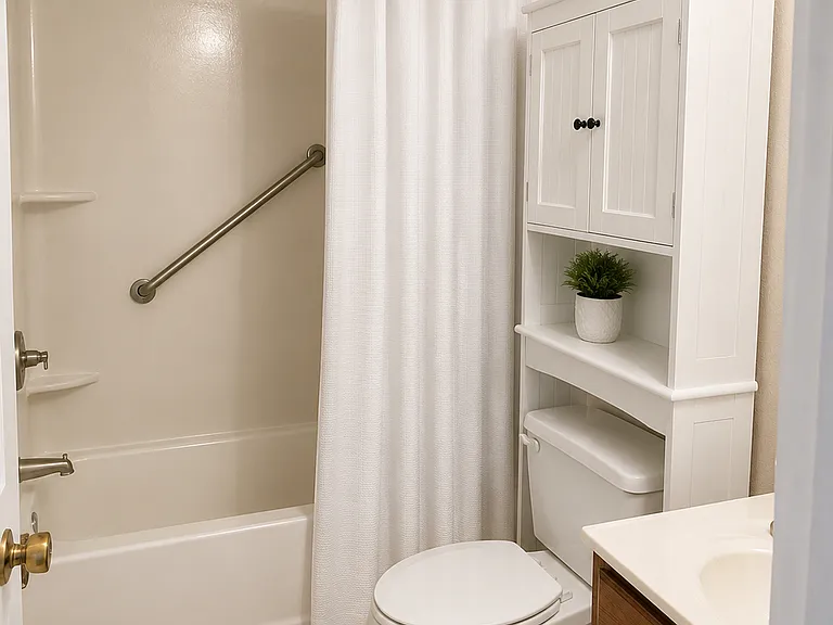 Full bath with shower/tub enclosure.