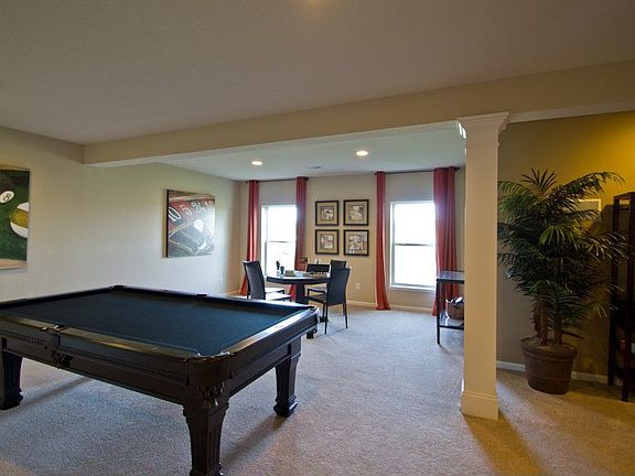 Finished basement with large windows