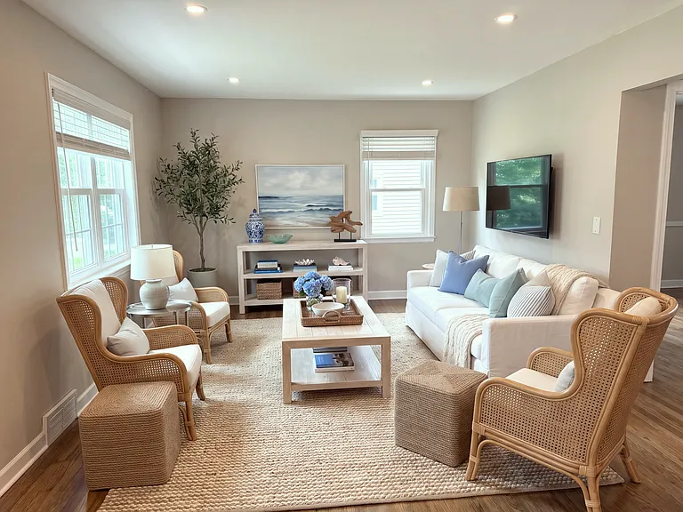 Family room area with installed TV (virtually staged)