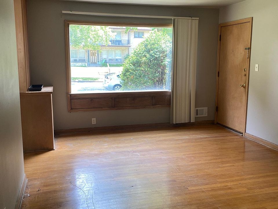 Living room 13'x16' from hallway, front door to right, kitchen/dining to left