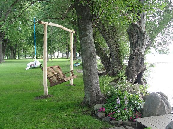 Imagine an afternoon reading on this lakeside glider.