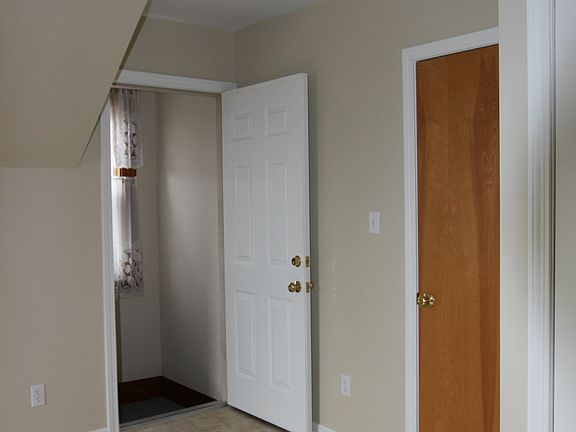 Bedroom, showing stairwell to front porch