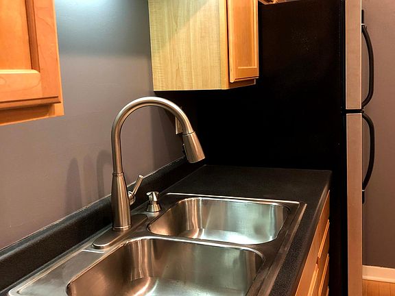 Brand new, modern kitchen faucet and soap dispenser