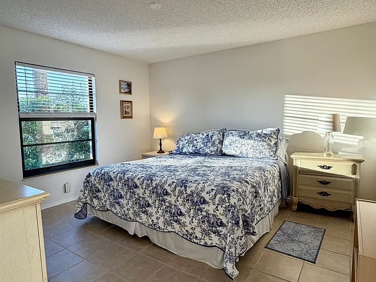 Spacious Primary Bedroom w/ stunning lake & golf course views & HUGE walk-in closet!