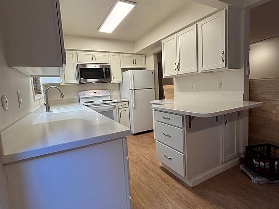 Light bright kitchen with home like storage