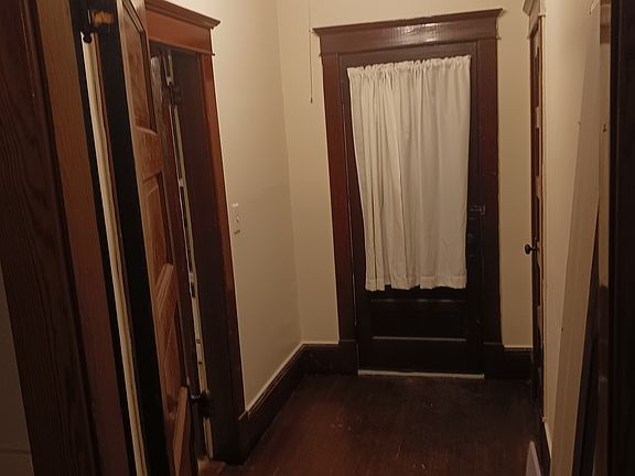 Hall off kitchen with cedar lined closet