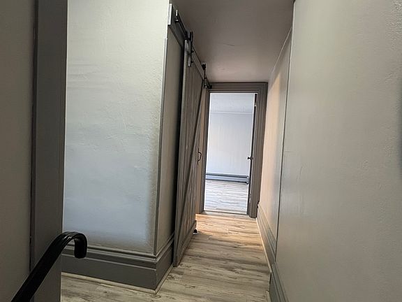 Hallway to bathroom and one of the bedrooms.