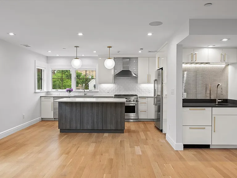 Kitchen island and wet bar with wine fridge
