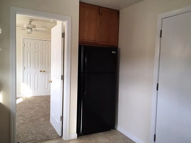 Kitchen, entry to Bedroom 1 (closet in view)
