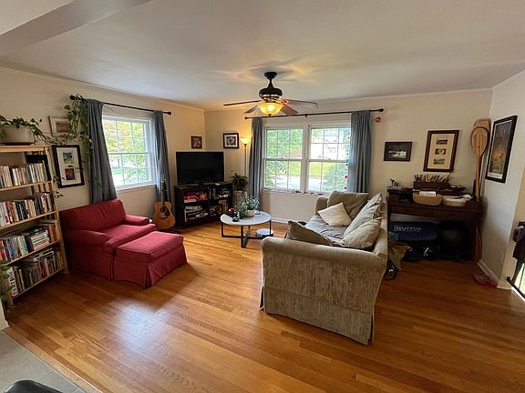 Sunny living room. Can accommodate a dining room table as well if configured to do so. This room is open to the kitchen.