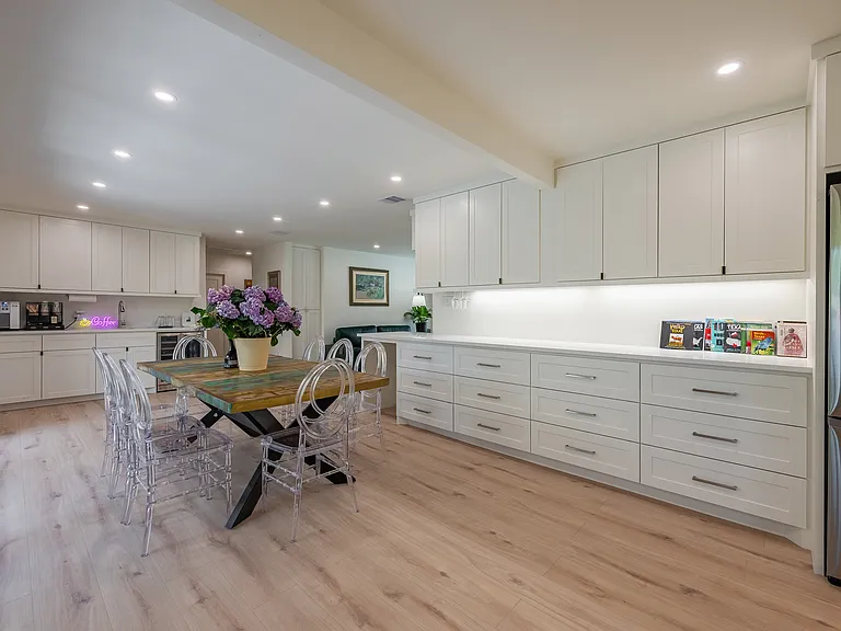 Spacious dining area connecting seamlessly to the kitchen and living room, perfect for hosting gatherings.