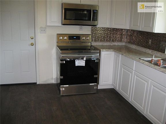 New kitchen cabinets, new stainless range, dishwasher, microwave and refrig all staying