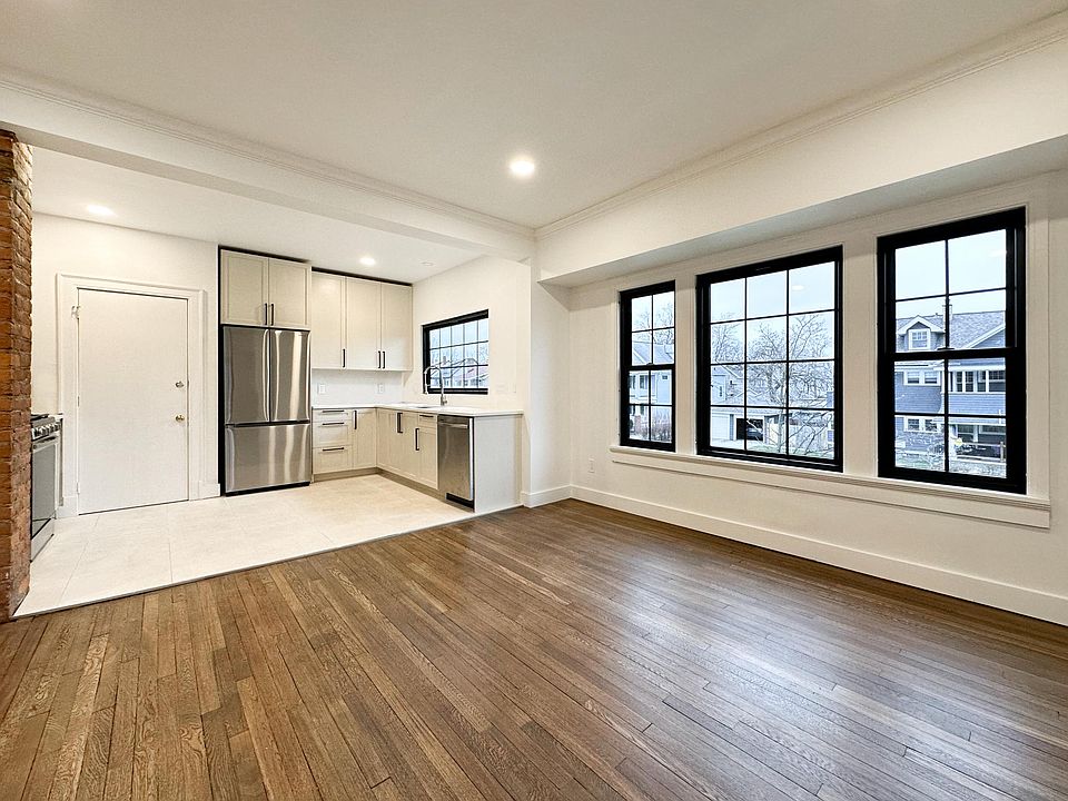 Newly renovated kitchen features custom soft-close cabinets and uppers that go all the way to the ceiling. Large new windows in kitchen and dining let in loads of natural light.