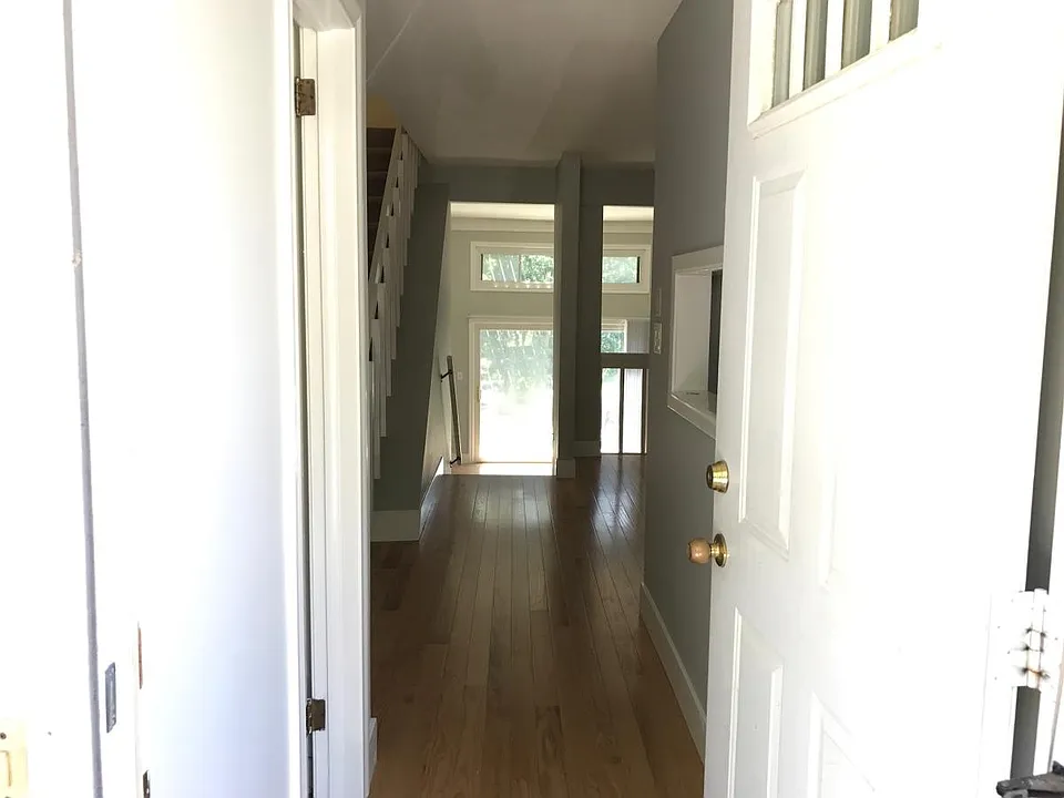 Entrance - Welcome Home! First level has coat closet, half-bath for guests and hardwood floors throughout