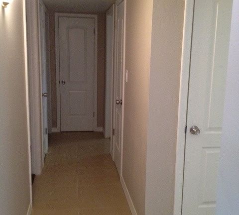 Hallway with linen/additional closets