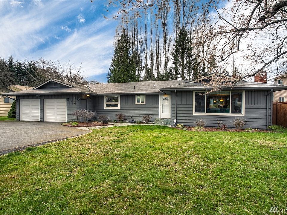 Well maintained rambler with metal tile roof.