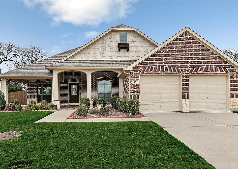 Beautiful curb appeal welcomes you home. Enjoy dinner or just relax on the covered front porch.