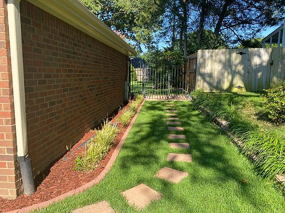 entry to back yard thru thru metal gate