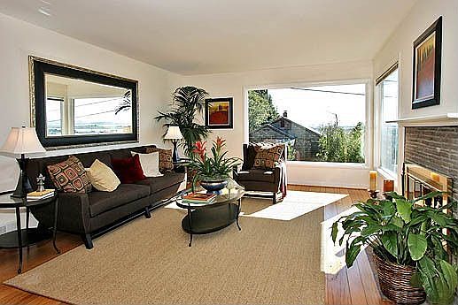 Inviting living room with gas fireplace and panoramic Bay & Golden Gate views