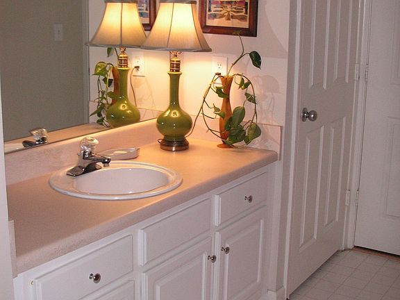two large bathrooms with linen closets