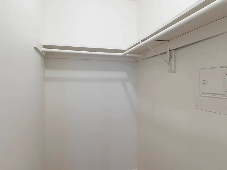 Walk-in closet in a unit at Cuming St. Apartments.