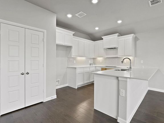 Kitchen in the Grammy home plan by Trophy Signature Homes