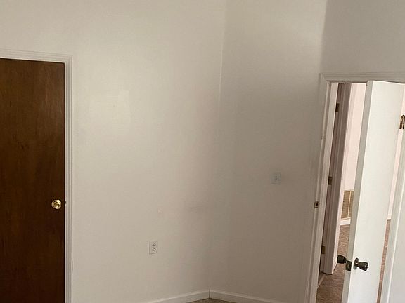 This view is from the bedroom looking at the doorway to the bedroom. Door on the left is closet.