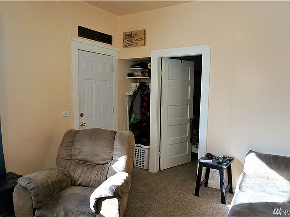 Entrance to main home w/ tall ceilings solid wood doors - so much charm. 