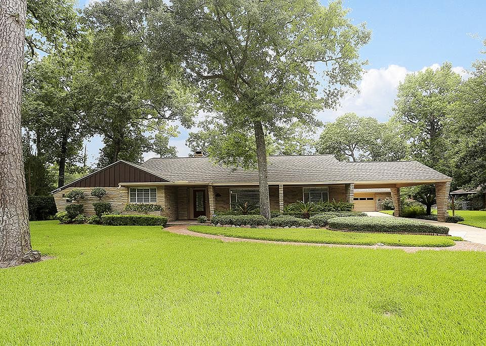 WONDERFUL HOME TO LIVE IN NOW AND BUILD DREAM HOME LATER ON THIS 27,000+ CORNER LOT!