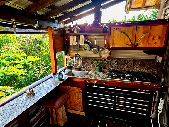Custom cottage kitchen with bar counter, and seating underneath bar. Amazing ocean view!