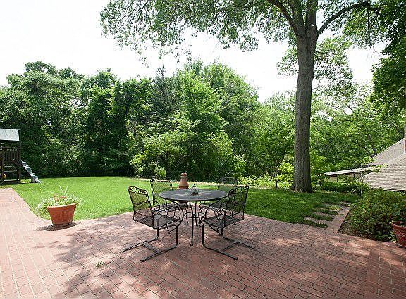Brick patio in private back yard