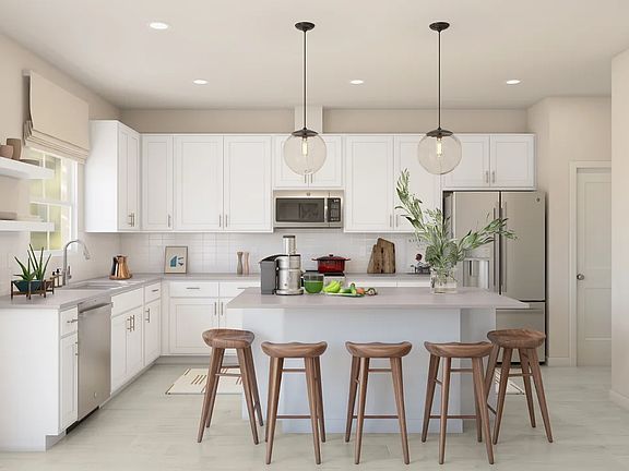 Kitchen with pendant lighting and center island - Artist Rendering