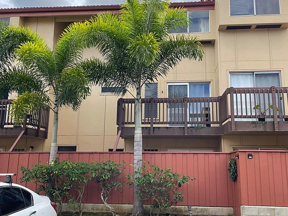 Living room side and 2nd bedroom upstairs of townhome, unit is 2nd and 3rd floor.