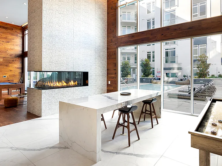 Clubroom with firepit, billiards table, and shuffle board