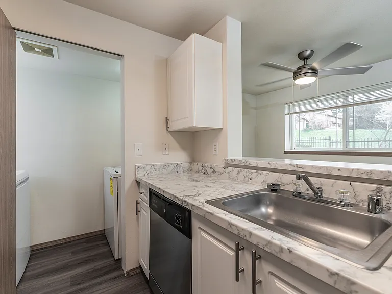 Convenient kitchen design with nearby laundry access.